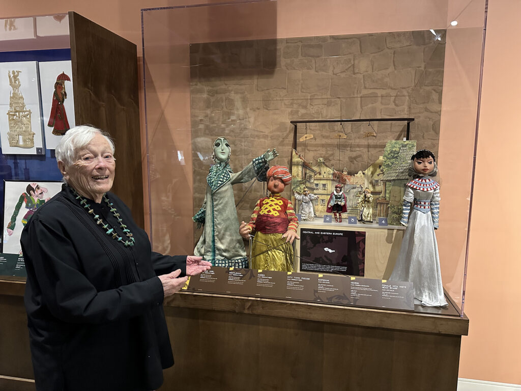 Figure 9. Nancy Staub with Czech and Russian puppets at the Worlds of Puppetry Museum, 2024. (Photo: Tommy Staub)