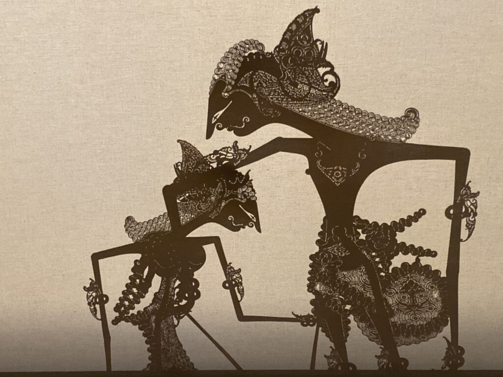 Figure 4.  A wayang scene in which Abimanyu comforts his fiancee, as it would be seen by the audience in shadow. (Photo: Ron Jenkins)